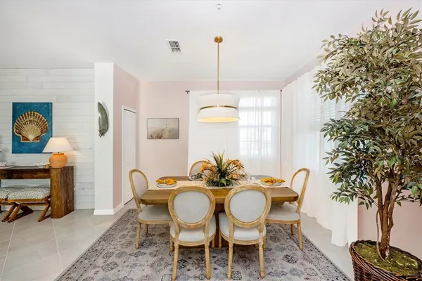 a kitchen with stainless steel appliances granite countertop a stove a refrigerator and microwave