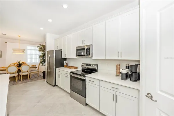 a bathroom with a double vanity sink mirror and shower