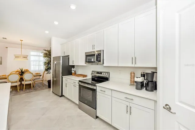 a bathroom with a double vanity sink mirror and shower