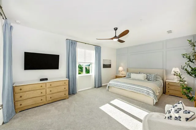 a bathroom with a toilet a sink and a mirror