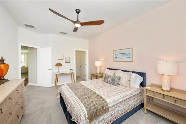 a swimming pool view with a seating space and a garden view