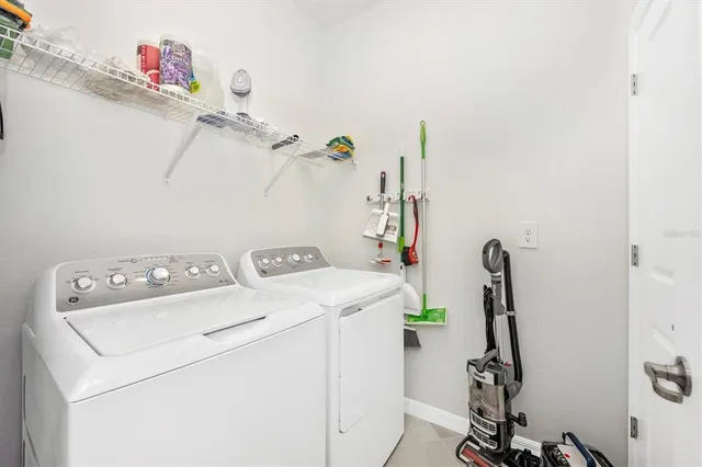 a view of a lake with a garden and seating space