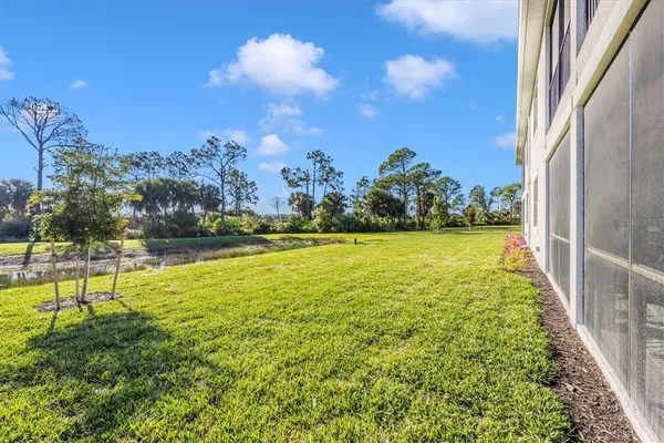 a view of a patio with a table and chairs