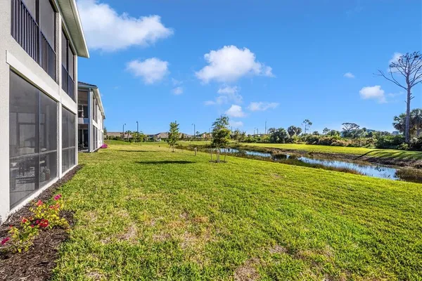 a view of a swimming pool with an ocean and trees