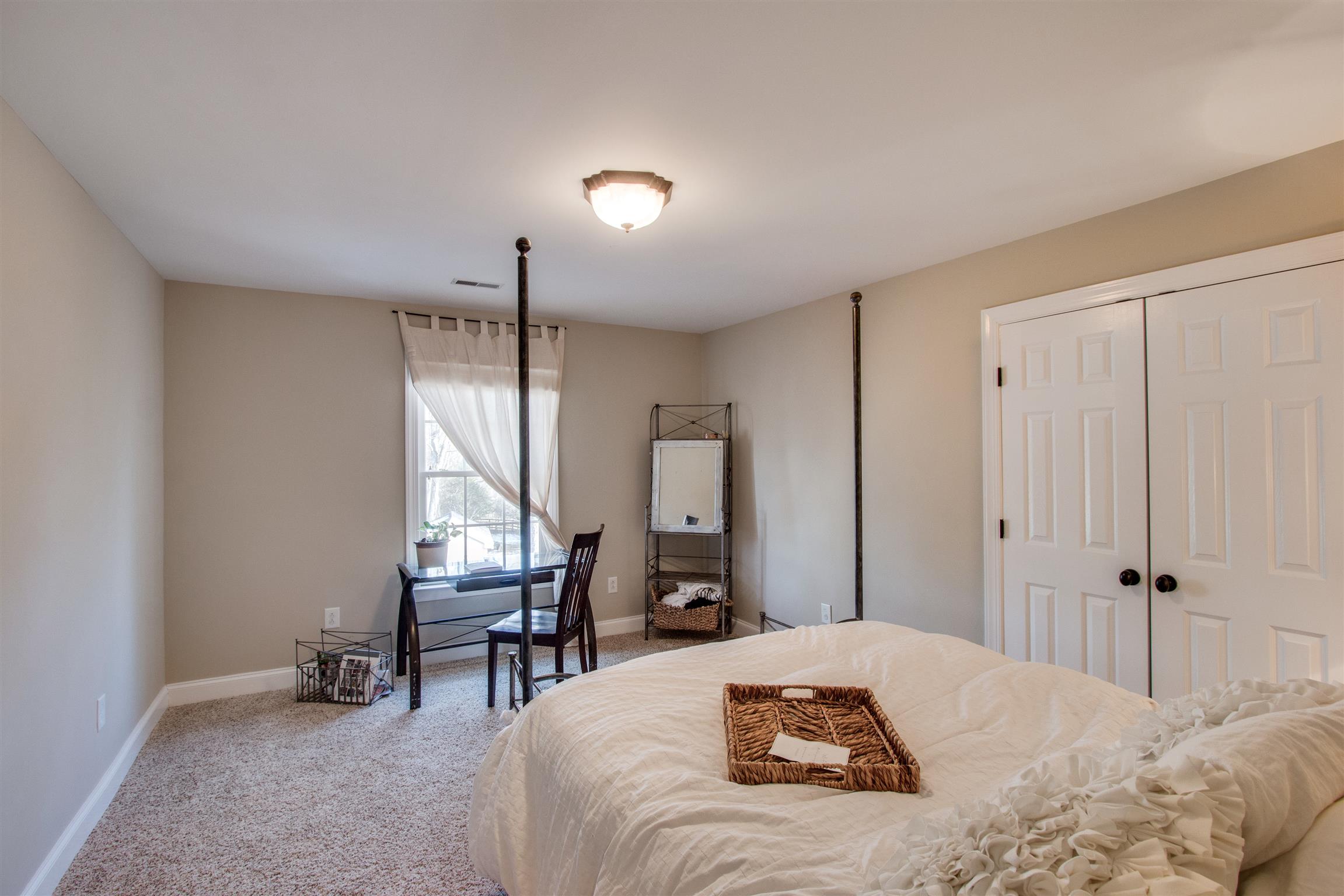 210 Ridgewater Way Mount Juliet, TN 37122 - Photo 14 of 24 a bedroom with a bed a table and a window