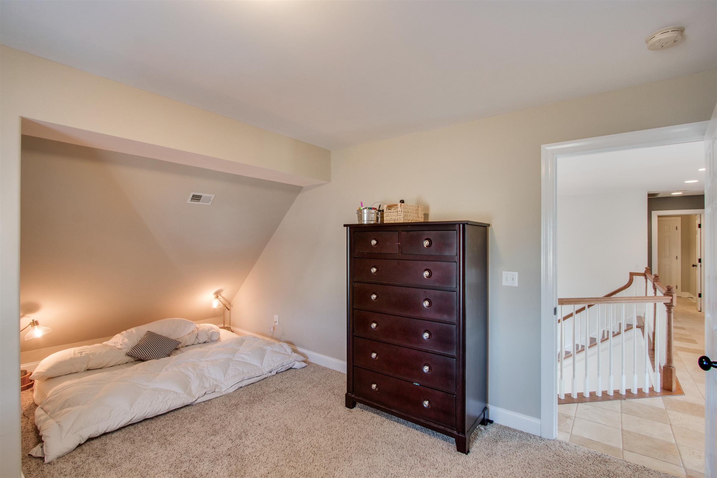 210 Ridgewater Way Mount Juliet, TN 37122 - Photo 17 of 24 a bedroom with a bed and a lamp on desk