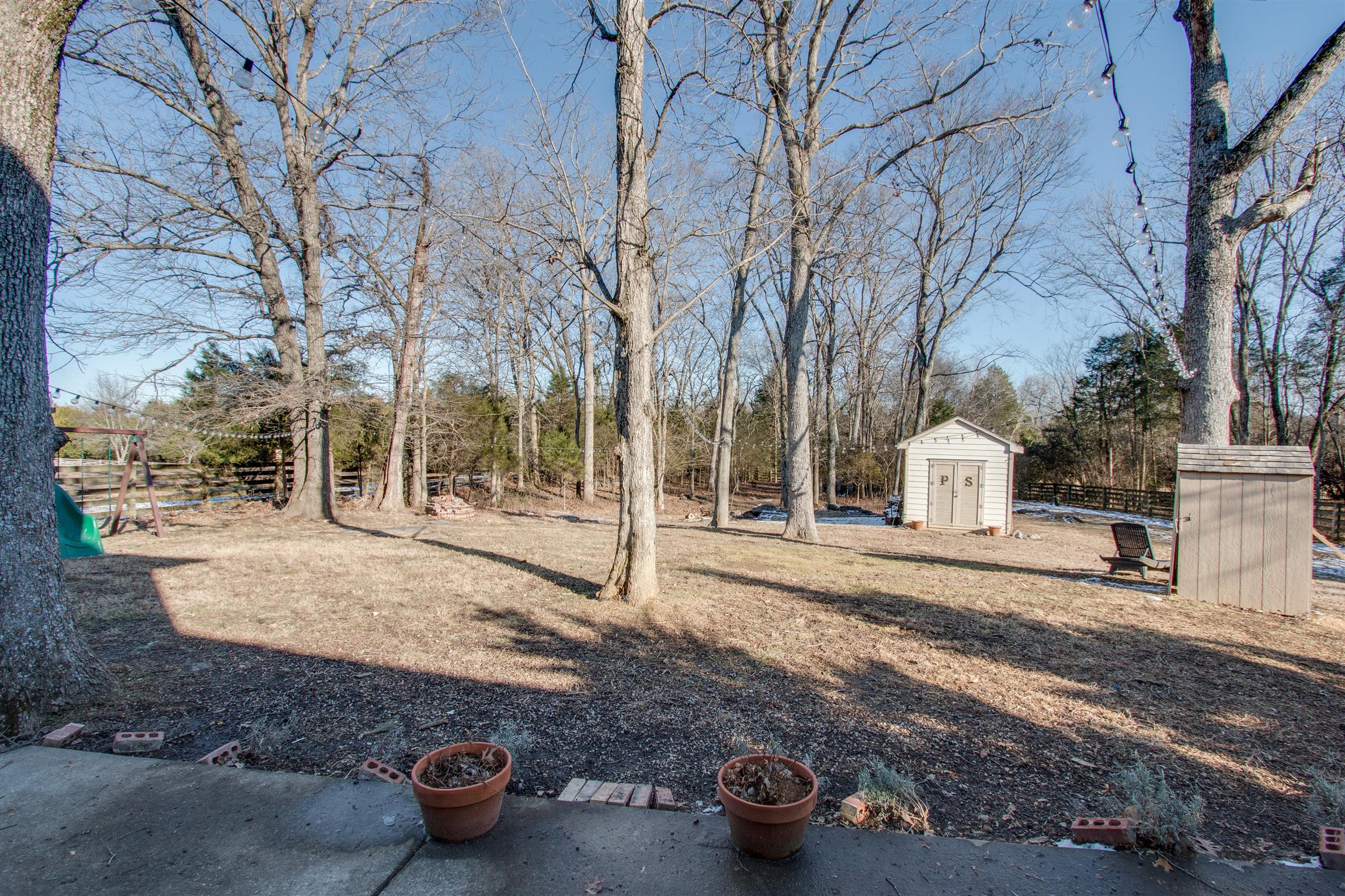 210 Ridgewater Way Mount Juliet, TN 37122 - Photo 23 of 24 a white house that has a tree on the side of it