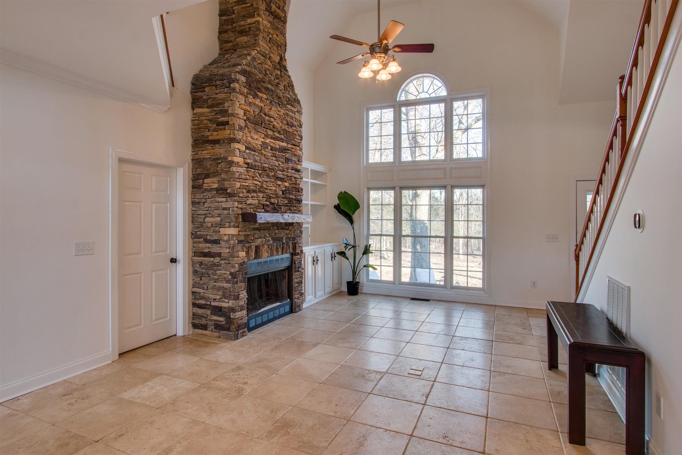 210 Ridgewater Way Mount Juliet, TN 37122 - Photo 4 of 24 an empty room with windows and fireplace