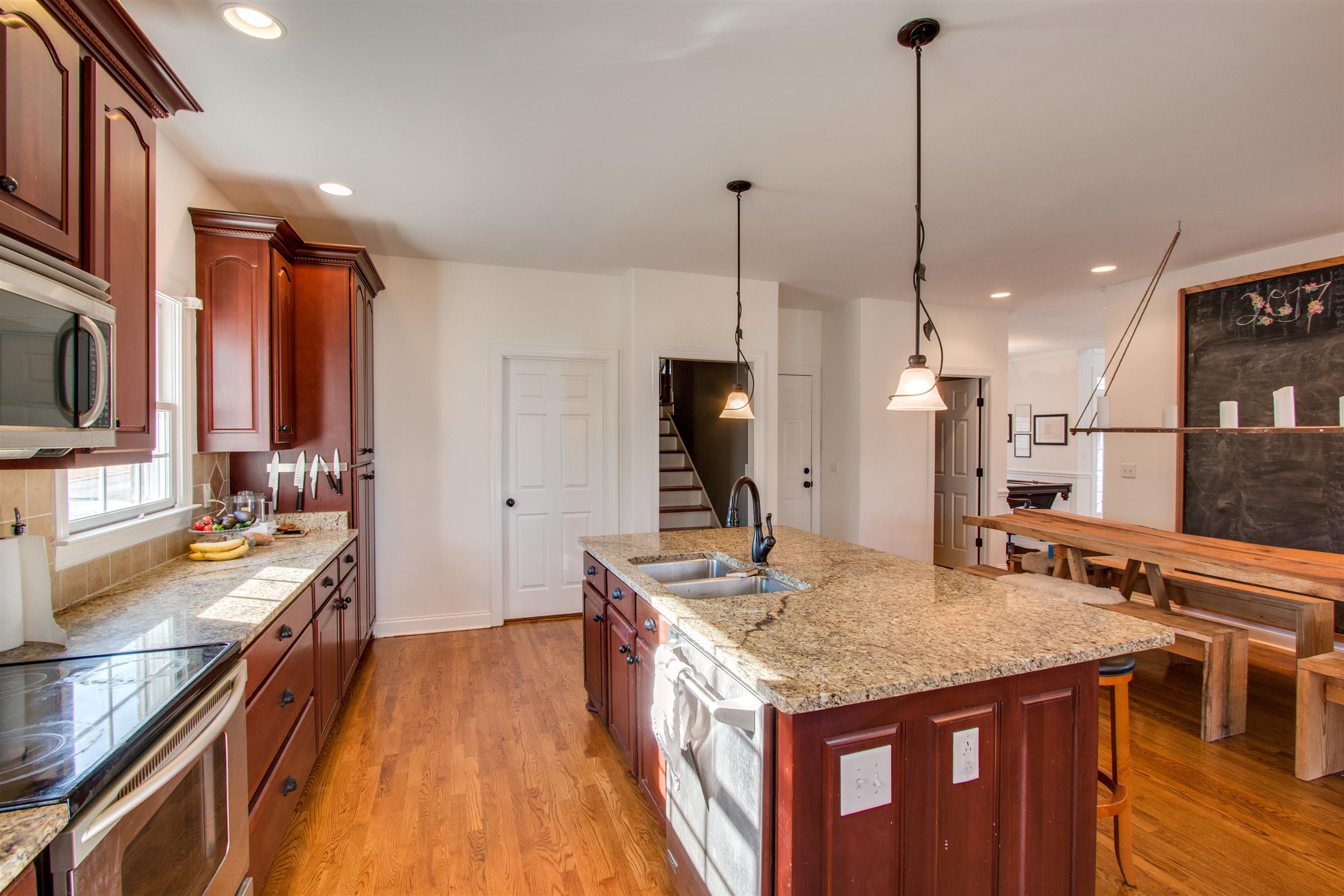 210 Ridgewater Way Mount Juliet, TN 37122 - Photo 6 of 24 a kitchen with stainless steel appliances granite countertop a stove a sink and a wooden floor