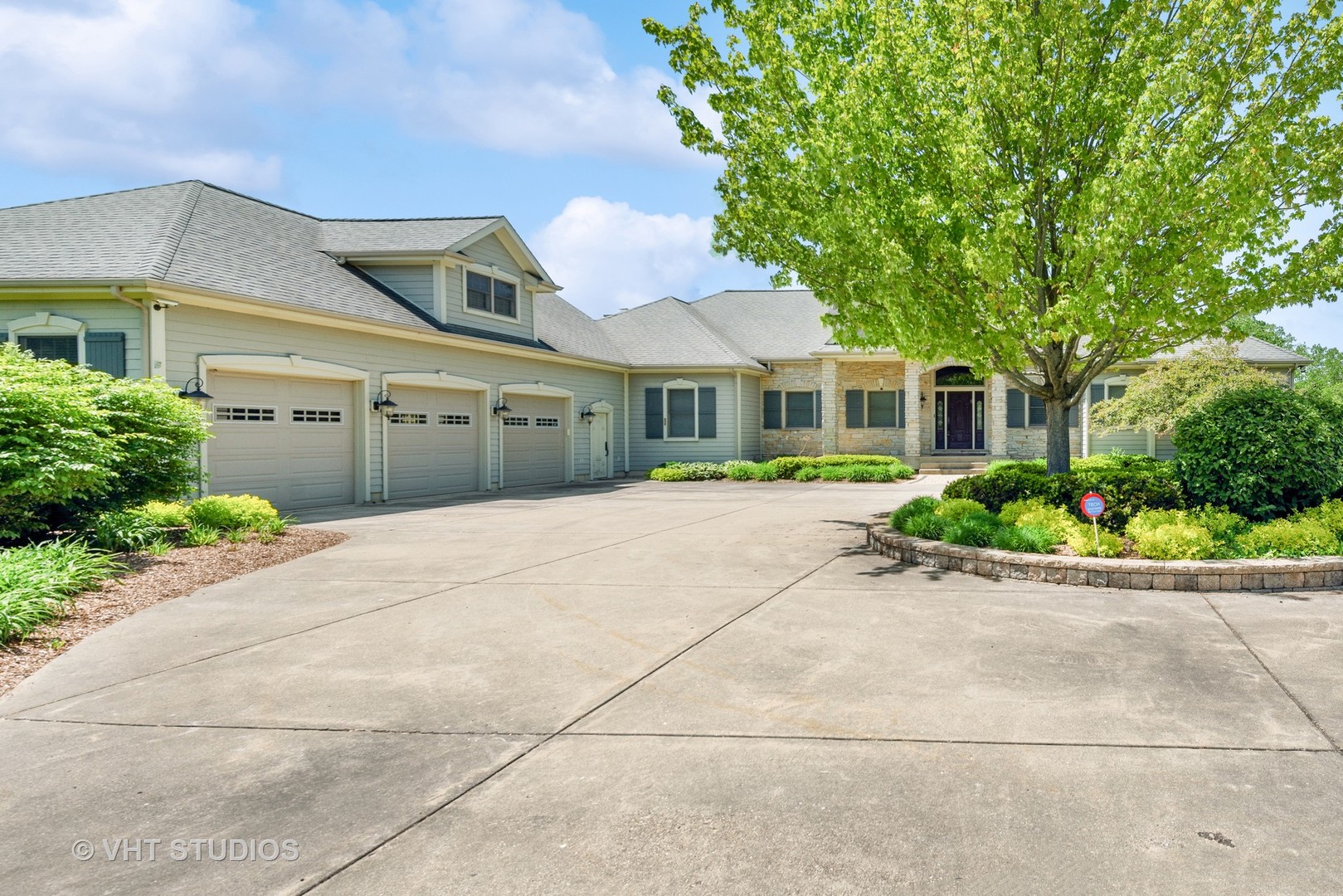 front view of a house with a garden