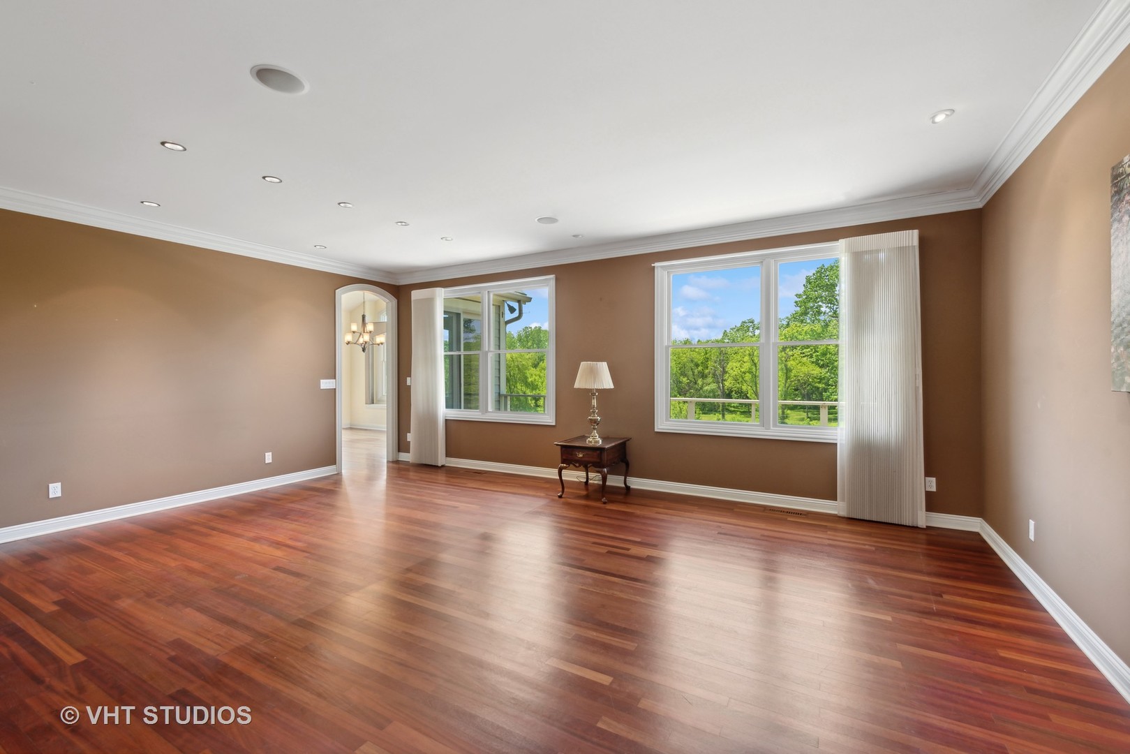 10701 Knickerbocker Road Harvard, IL 60033 - Photo 11 of 46 a view of an empty room with wooden floor and a window