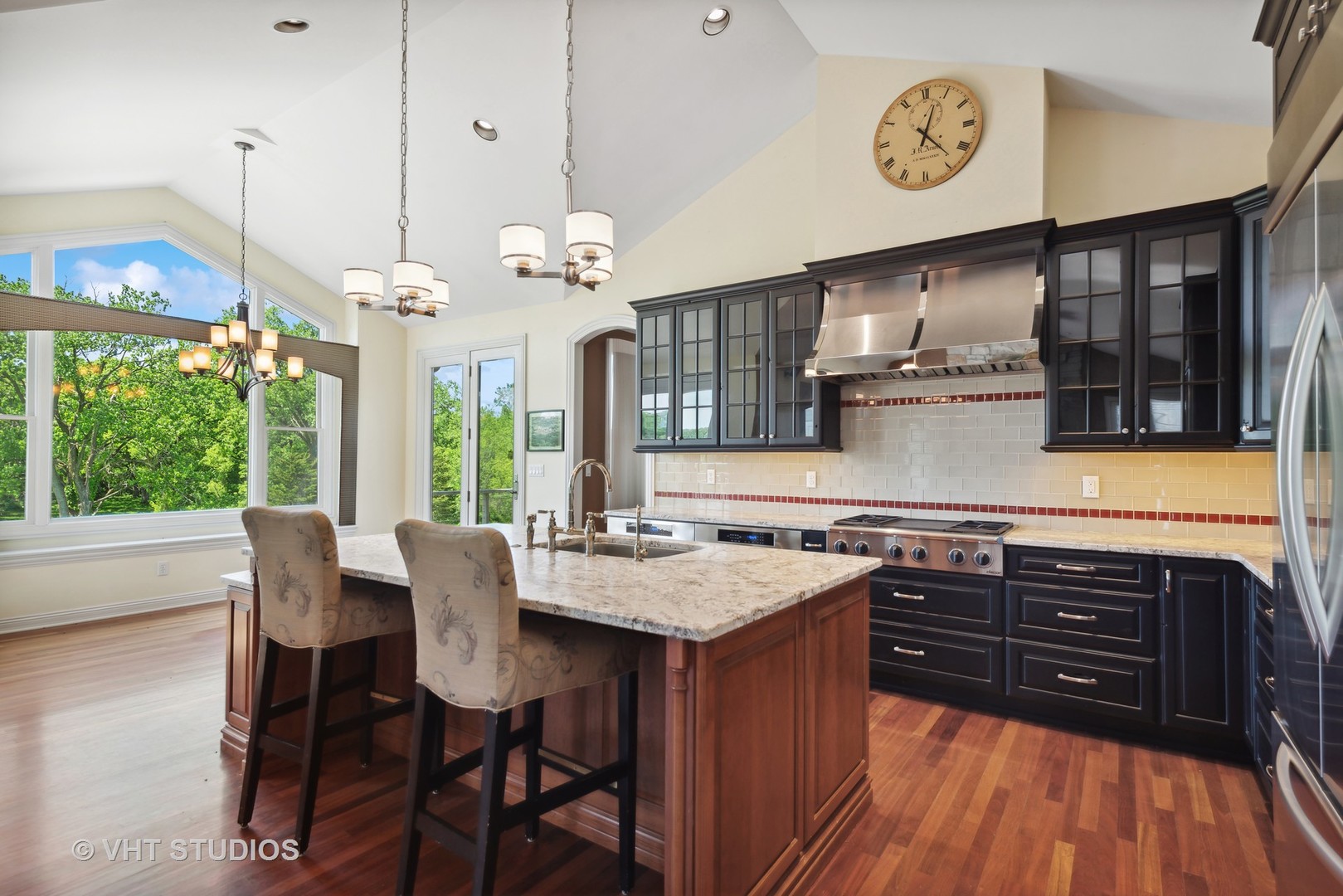 10701 Knickerbocker Road Harvard, IL 60033 - Photo 15 of 46 a kitchen with a table chairs and stove