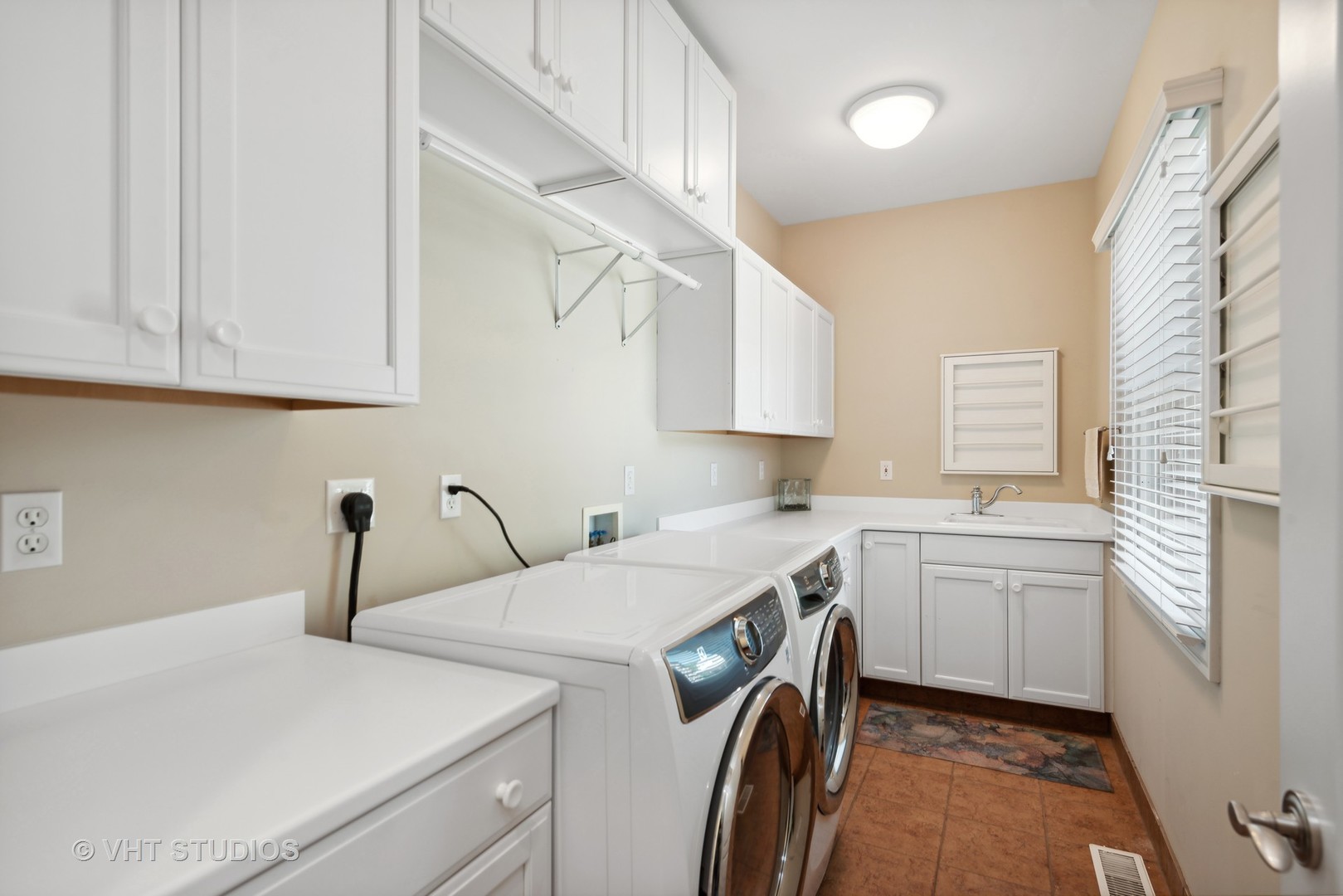 10701 Knickerbocker Road Harvard, IL 60033 - Photo 19 of 46 a kitchen with a sink a stove and cabinets