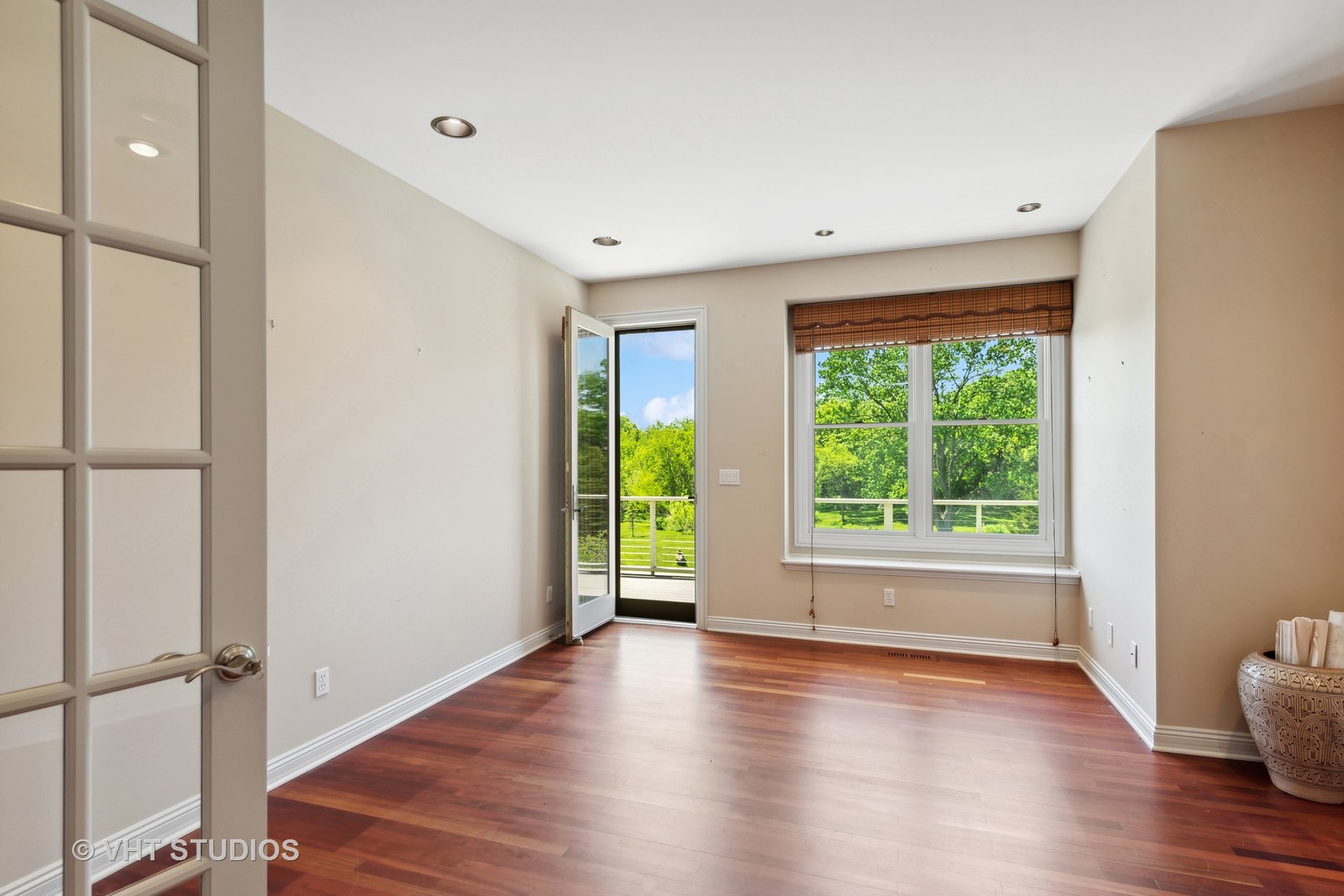 10701 Knickerbocker Road Harvard, IL 60033 - Photo 20 of 46 a view of an empty room with wooden floor and a window