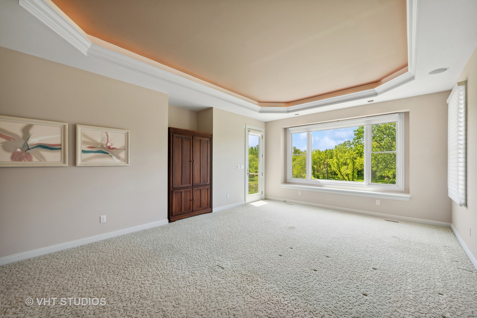 10701 Knickerbocker Road Harvard, IL 60033 - Photo 21 of 46 a view of a big room with windows and chandelier fan