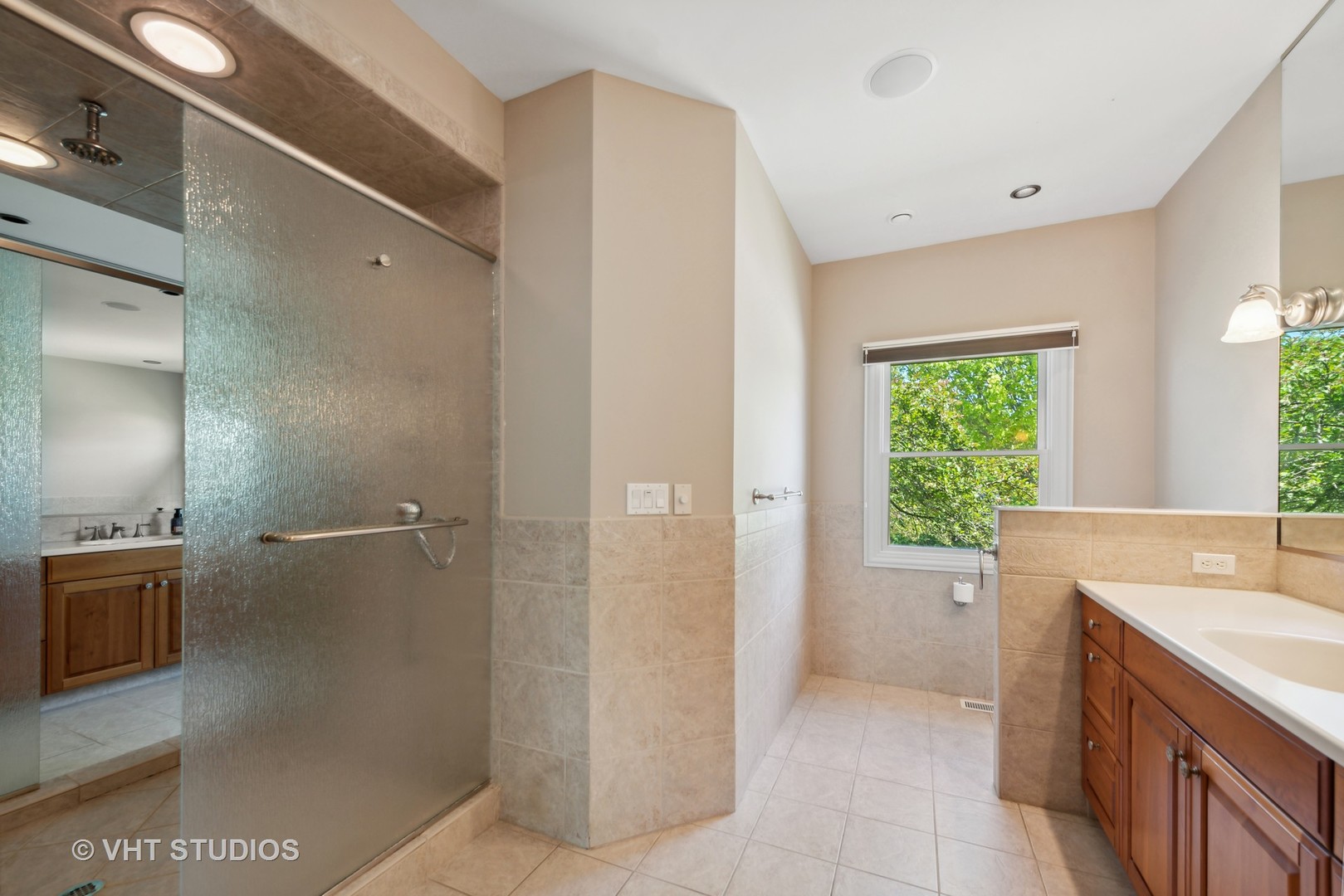 10701 Knickerbocker Road Harvard, IL 60033 - Photo 22 of 46 a bathroom with a tub sink and mirror