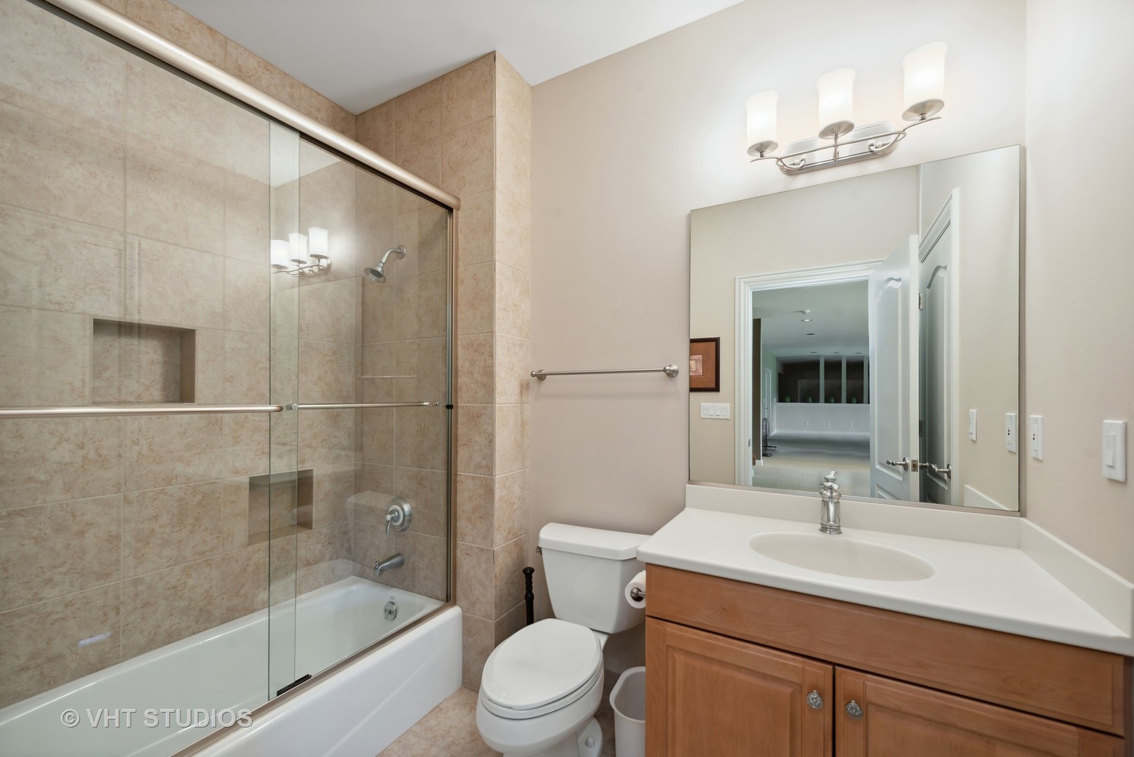 10701 Knickerbocker Road Harvard, IL 60033 - Photo 25 of 46 a bathroom with a sink a toilet and shower