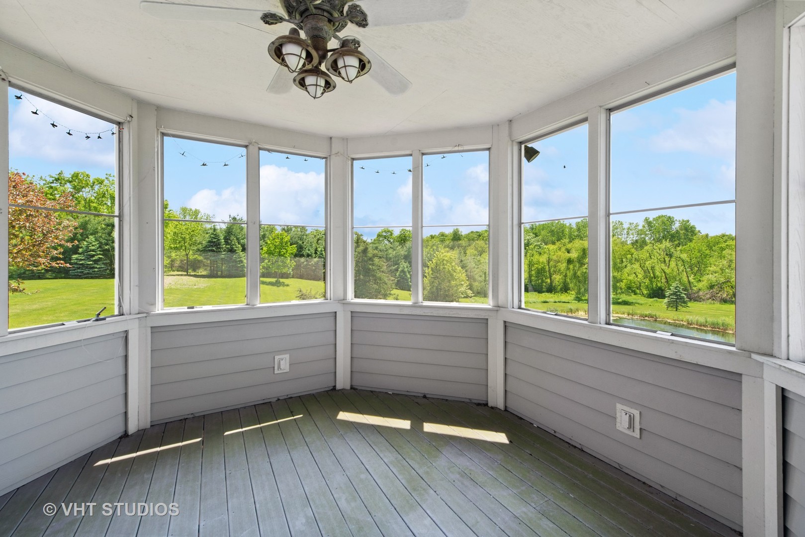 10701 Knickerbocker Road Harvard, IL 60033 - Photo 28 of 46 a view of an empty room with a window and wooden floor