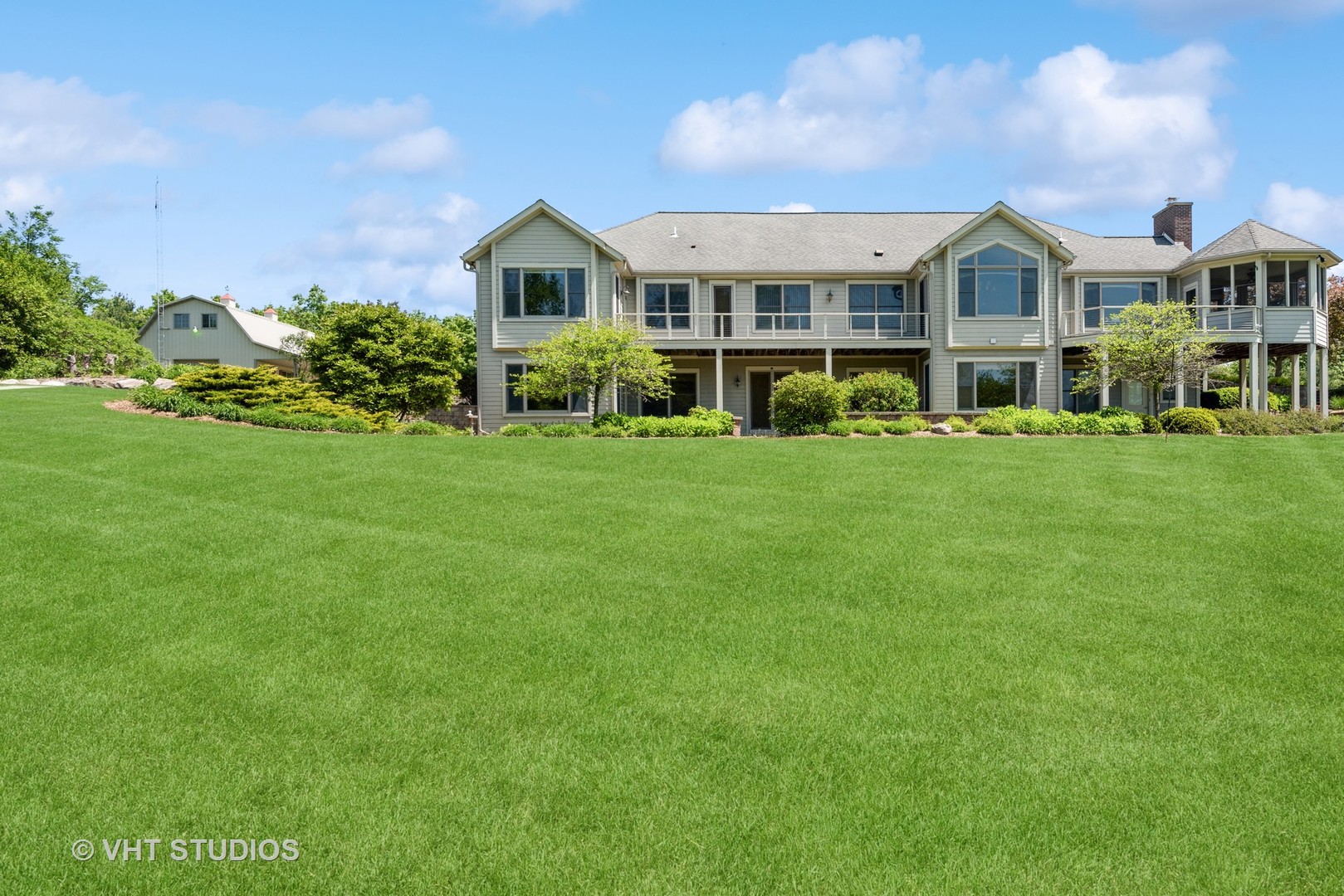 10701 Knickerbocker Road Harvard, IL 60033 - Photo 3 of 46 a front view of a house with a garden