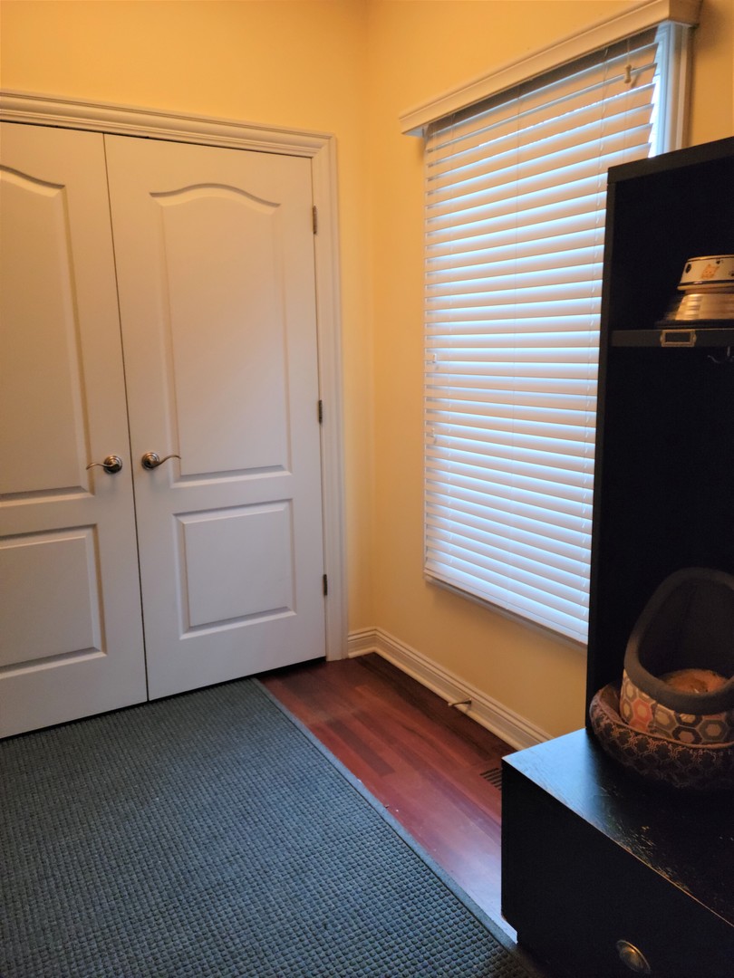 10701 Knickerbocker Road Harvard, IL 60033 - Photo 33 of 46 a view of a room with wooden floor