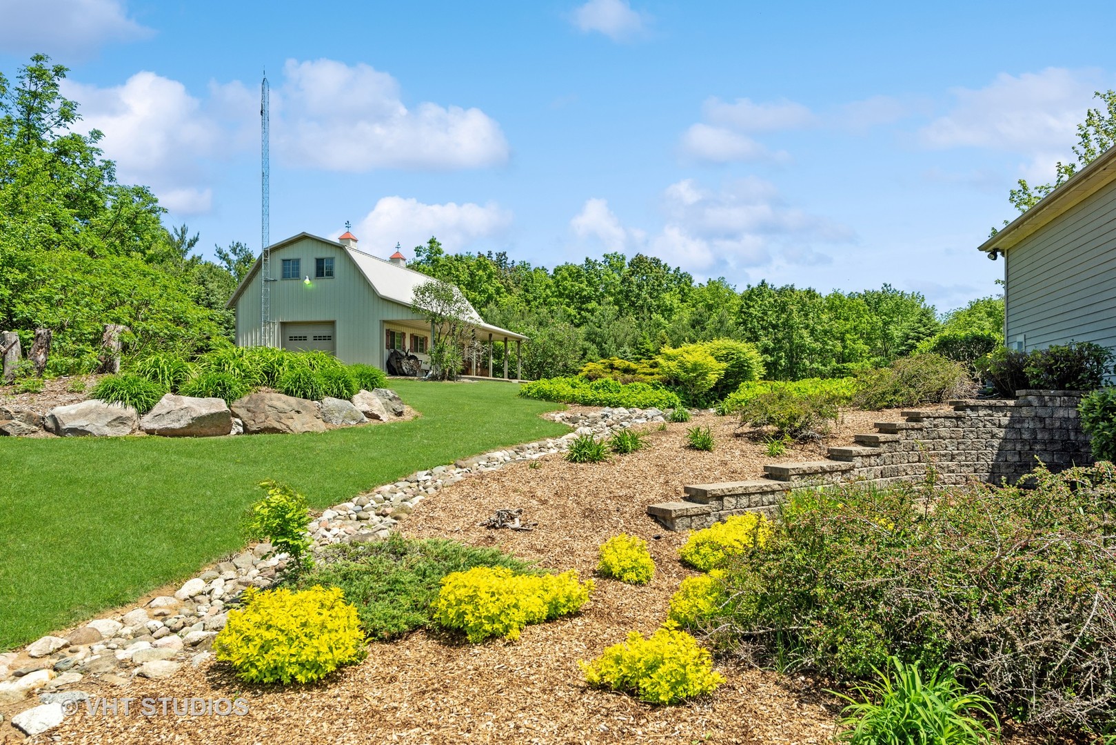10701 Knickerbocker Road Harvard, IL 60033 - Photo 8 of 46 a view of a garden with a building in the background