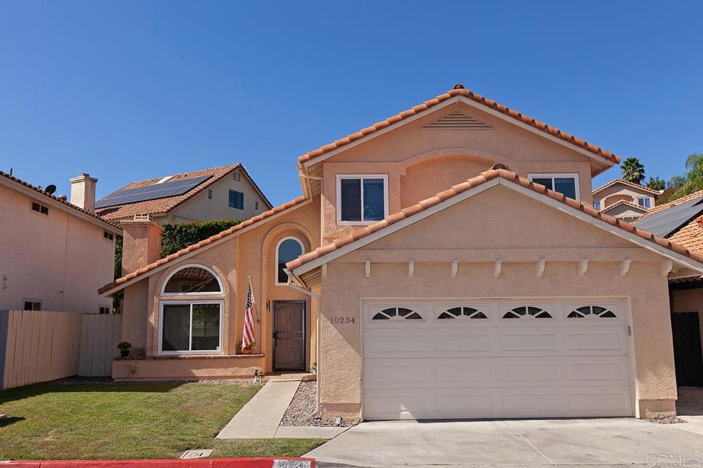 10234 Stone Point Lane Spring Valley, CA 91977 - Photo 1 of 1 a front view of a house with a yard