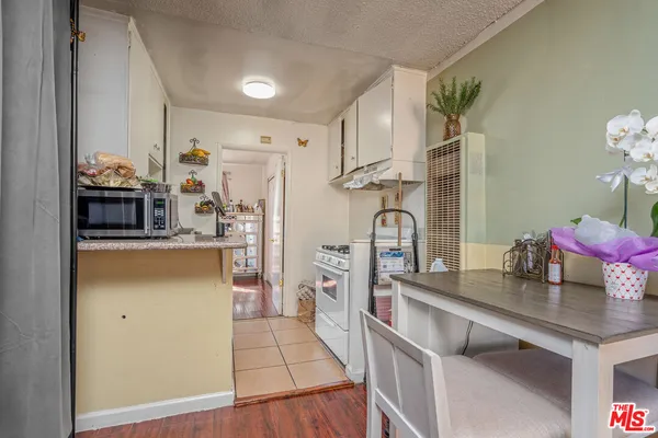 a bedroom with a bed and a table in it