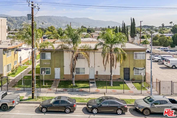 a view of a cars parked in front of a building
