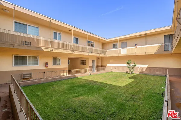 a view of a balcony with a floor to ceiling window