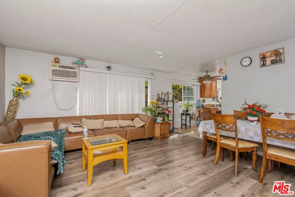 a bedroom with a bed and flat screen tv