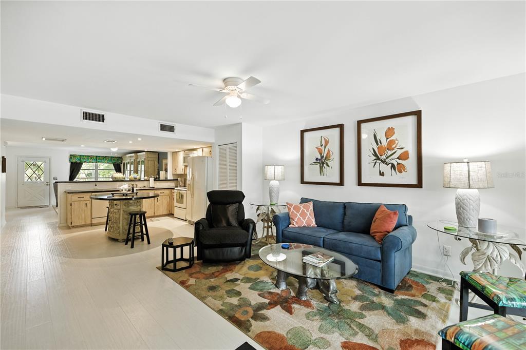 9951 Southwest 88th Court Road, Unit B Ocala, FL 34481 - Photo 13 of 29 a living room with furniture kitchen view and a table