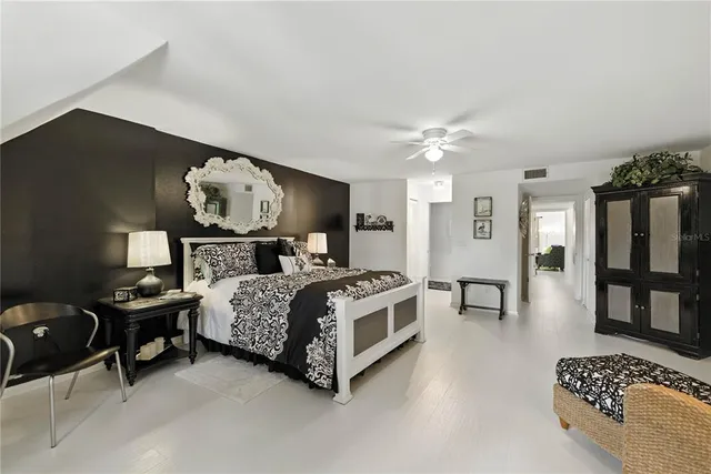 a bathroom with a sink mirror and vanity