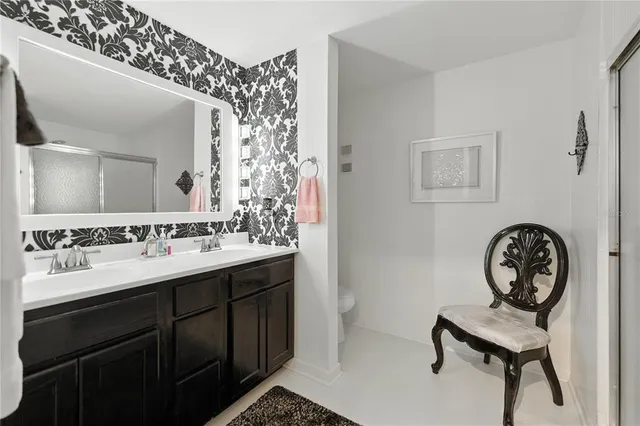 a bathroom with a shower and a sink