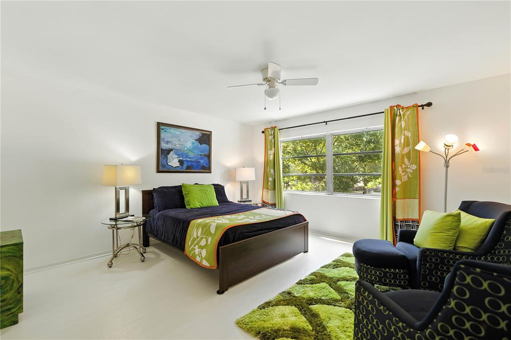 9951 Southwest 88th Court Road, Unit B Ocala, FL 34481 - Photo 20 of 29 a bedroom with a bed and a couch