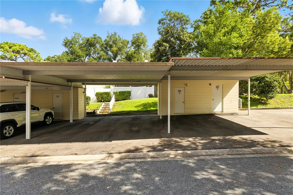 9951 Southwest 88th Court Road, Unit B Ocala, FL 34481 - Photo 28 of 29 a front view of a house with a yard and garage