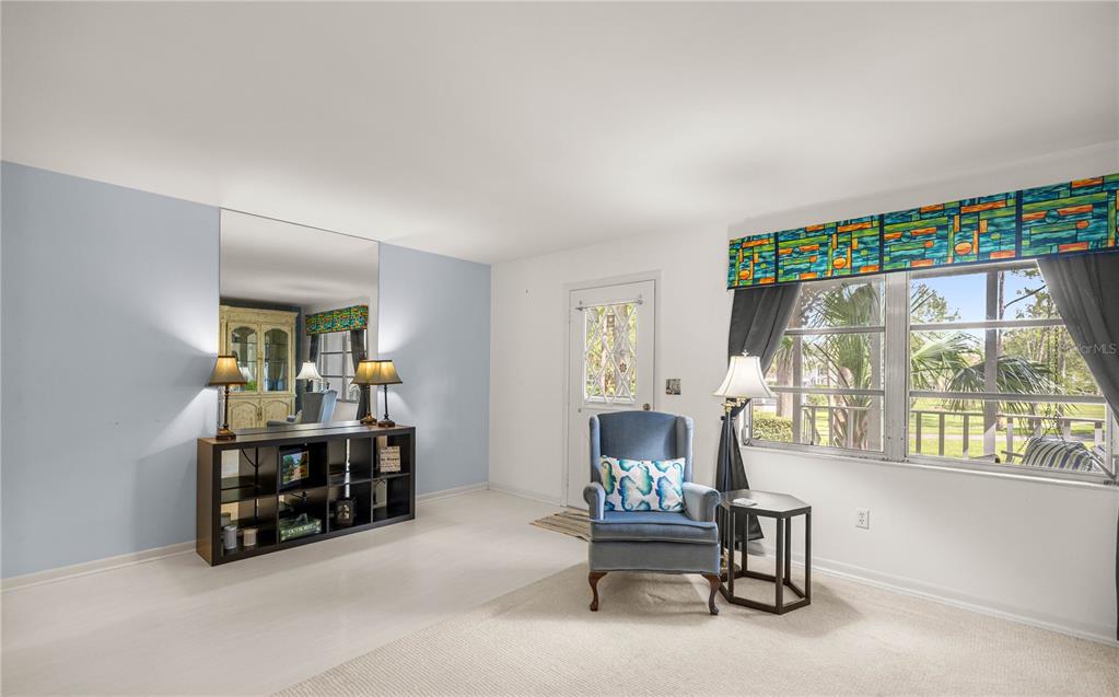 9951 Southwest 88th Court Road, Unit B Ocala, FL 34481 - Photo 6 of 29 a room with furniture and a window