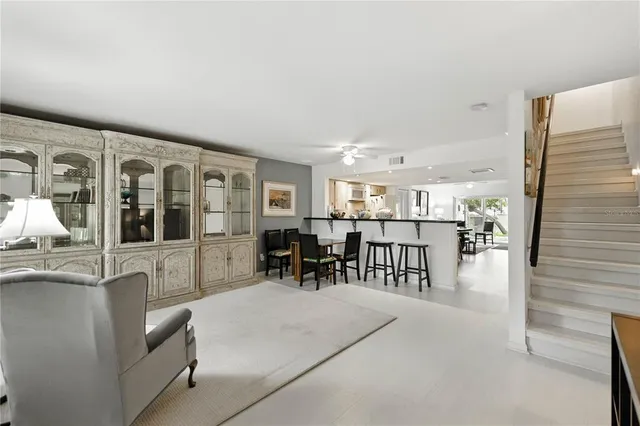 a view of a dining room kitchen with furniture and a large window