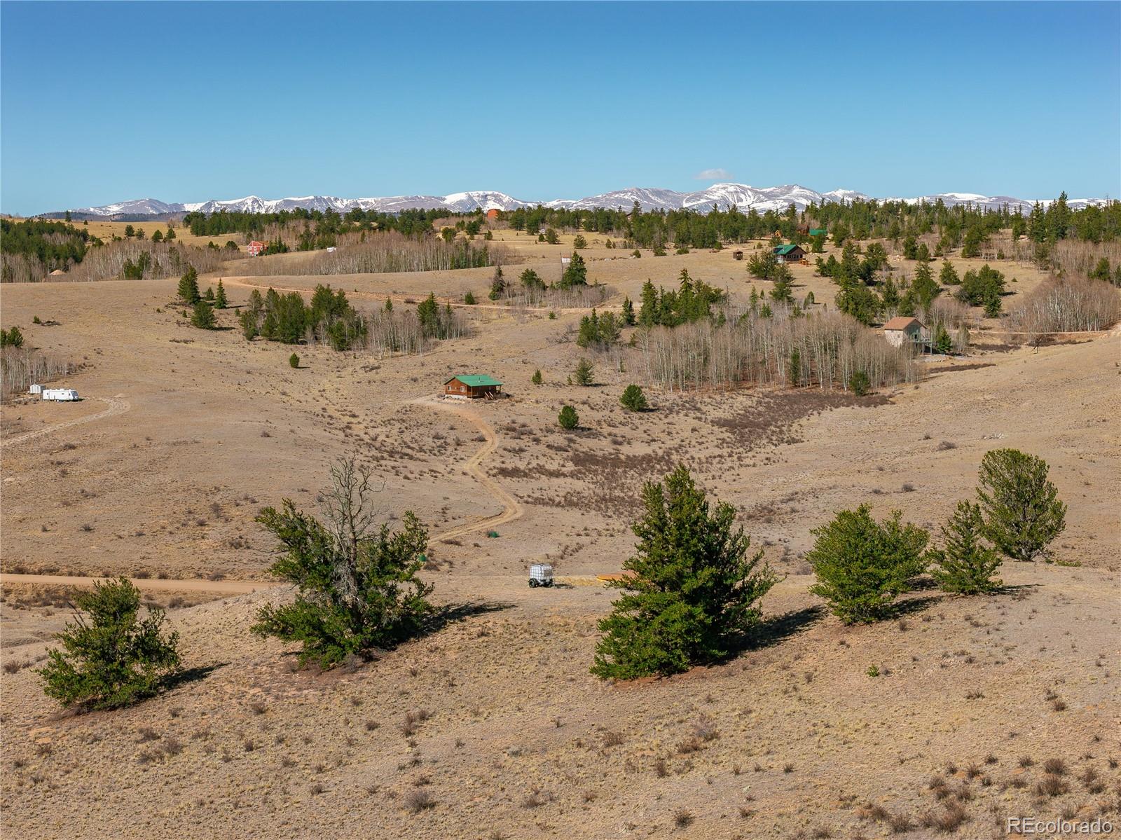 1457 Lippzana Road Jefferson, CO 80456 - Photo 15 of 29 a view of a road with a mountain in the background