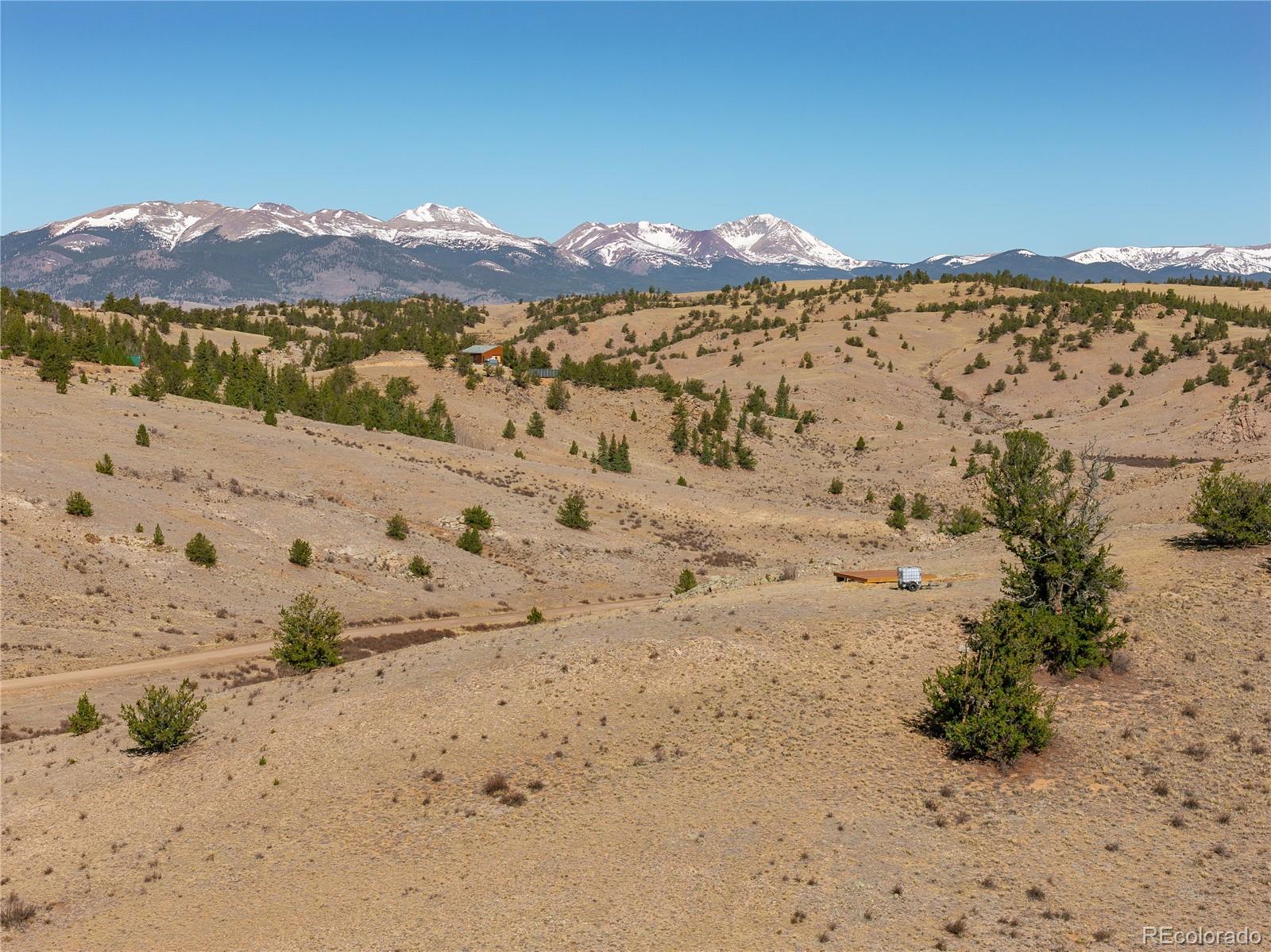 1457 Lippzana Road Jefferson, CO 80456 - Photo 17 of 29 a view of a backyard of snow