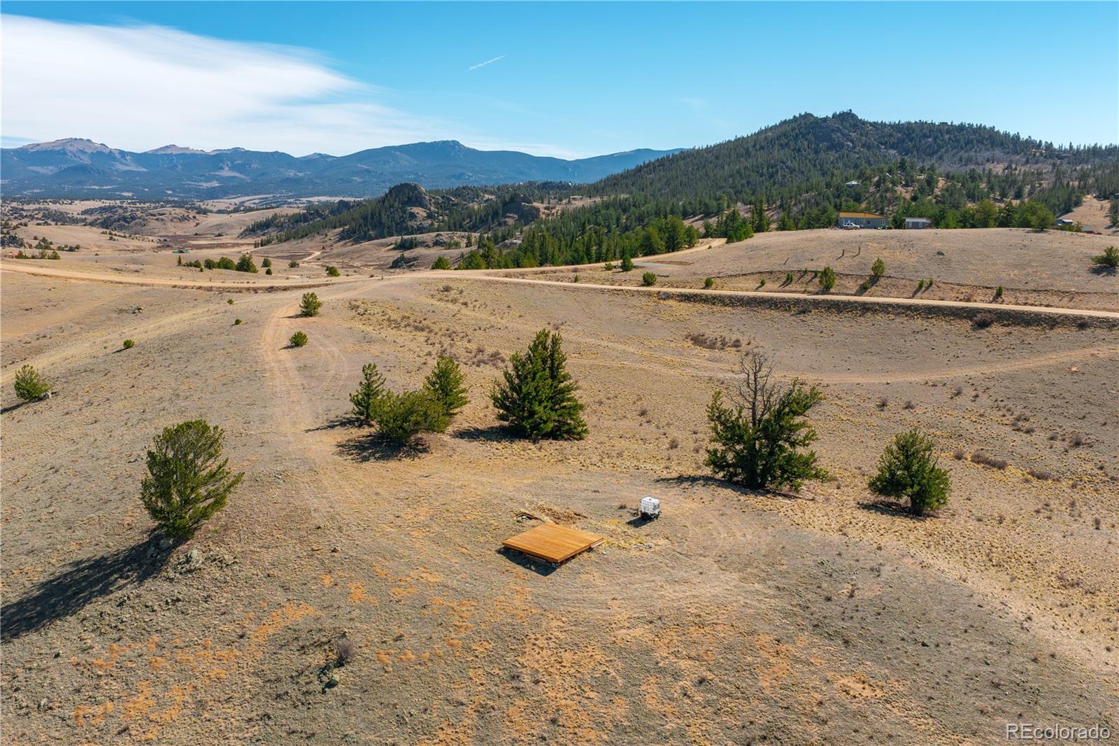 1457 Lippzana Road Jefferson, CO 80456 - Photo 3 of 29 a view of lake with mountain