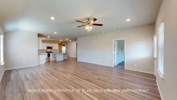 a view of kitchen with wooden floor and a window