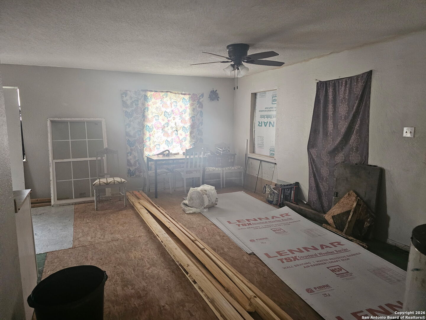 907 Hough Adkins, TX 78101 - Photo 5 of 10 a bathroom with a granite countertop sink a toilet and shower