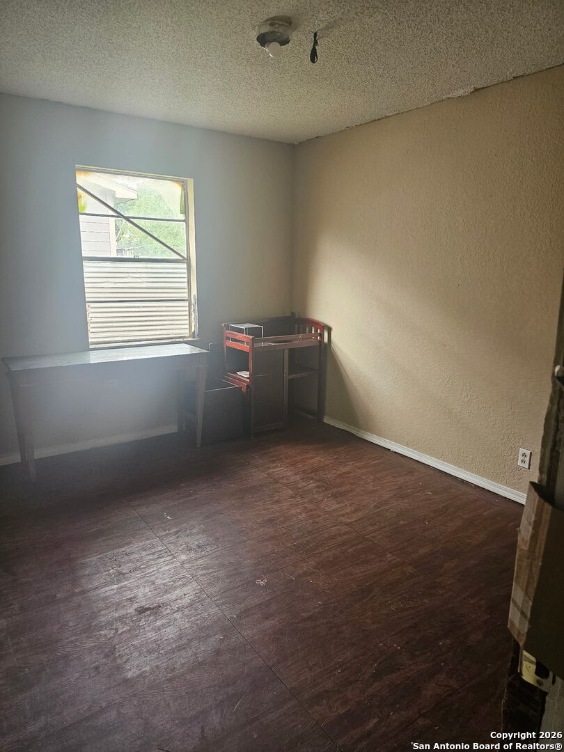 907 Hough Adkins, TX 78101 - Photo 9 of 10 an empty room with windows