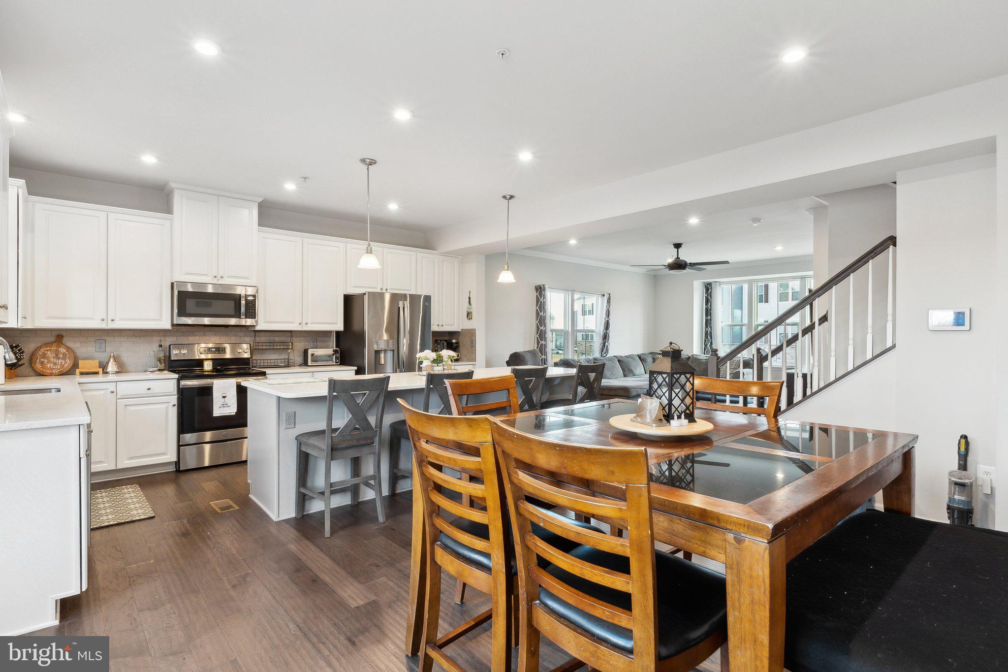 3012 Shaws Road Edgemere, MD 21219 - Photo 11 of 57 a large kitchen with a table and chairs
