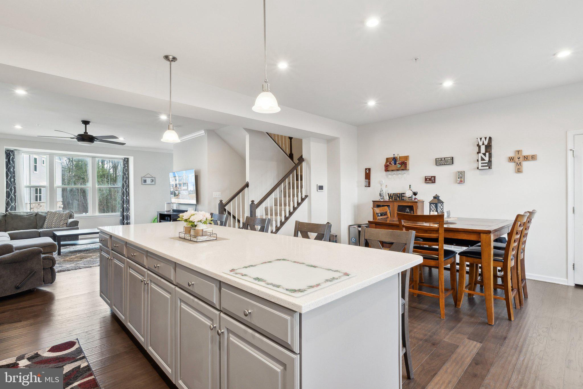 3012 Shaws Road Edgemere, MD 21219 - Photo 12 of 57 a kitchen with a stove and chairs