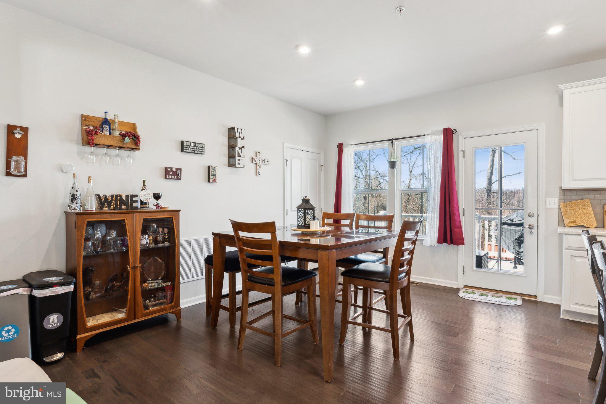 3012 Shaws Road Edgemere, MD 21219 - Photo 13 of 57 a view of a dining room with furniture and wooden floor