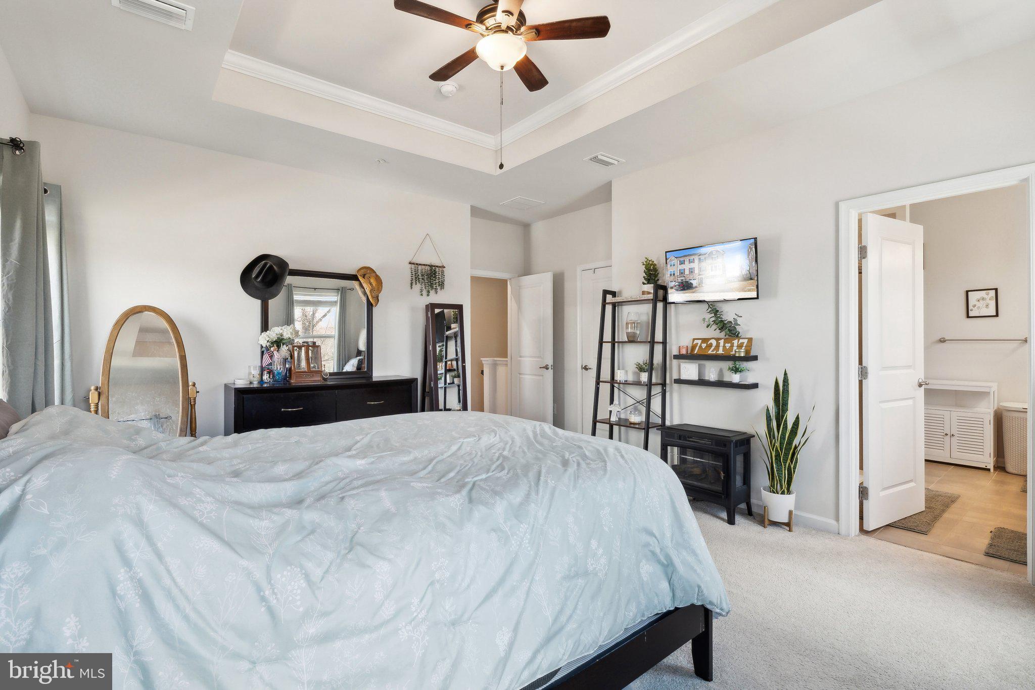 3012 Shaws Road Edgemere, MD 21219 - Photo 16 of 57 a bedroom with a bed and a flat screen tv