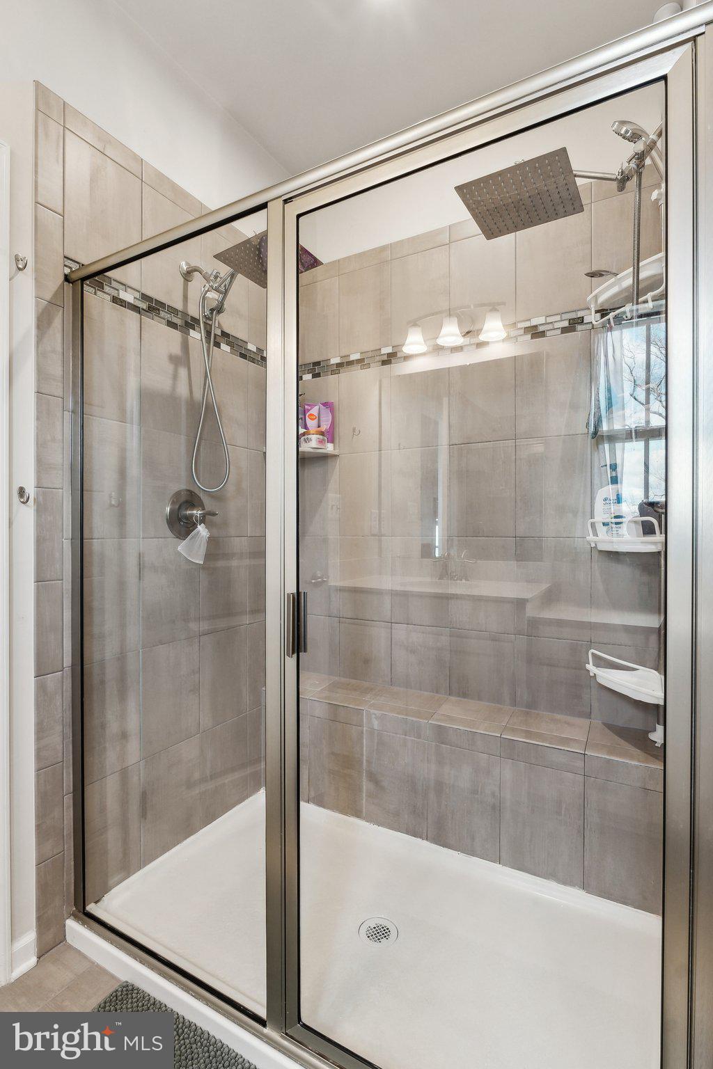 3012 Shaws Road Edgemere, MD 21219 - Photo 18 of 57 a bathroom with a glass shower door