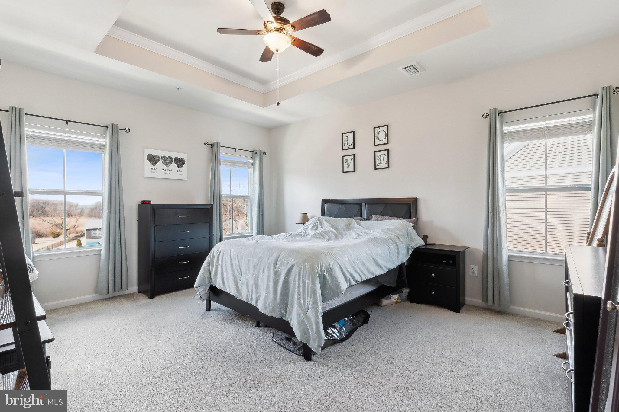3012 Shaws Road Edgemere, MD 21219 - Photo 20 of 57 a spacious bedroom with a bed and a window