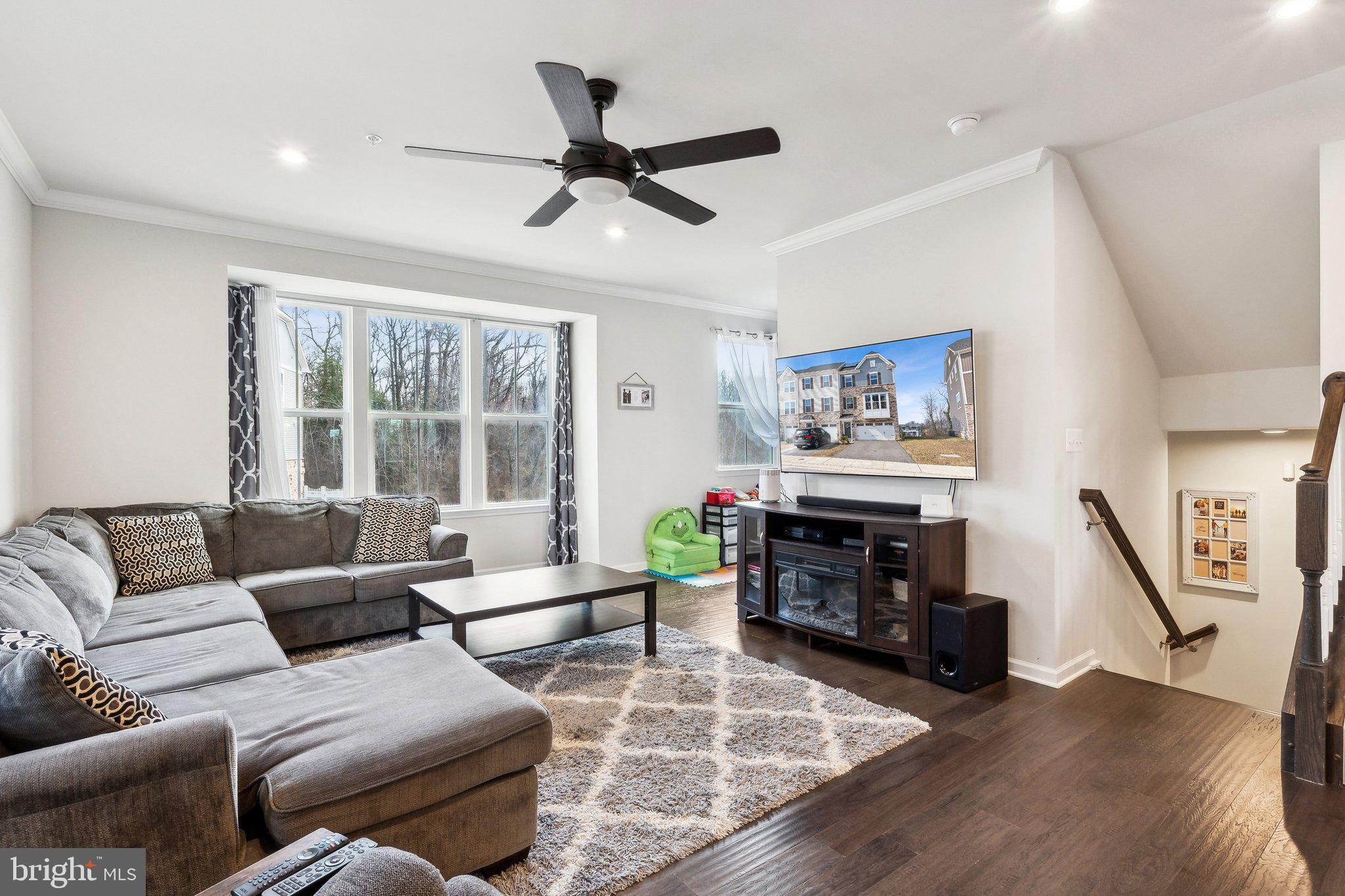 3012 Shaws Road Edgemere, MD 21219 - Photo 5 of 57 a living room with furniture and a fireplace